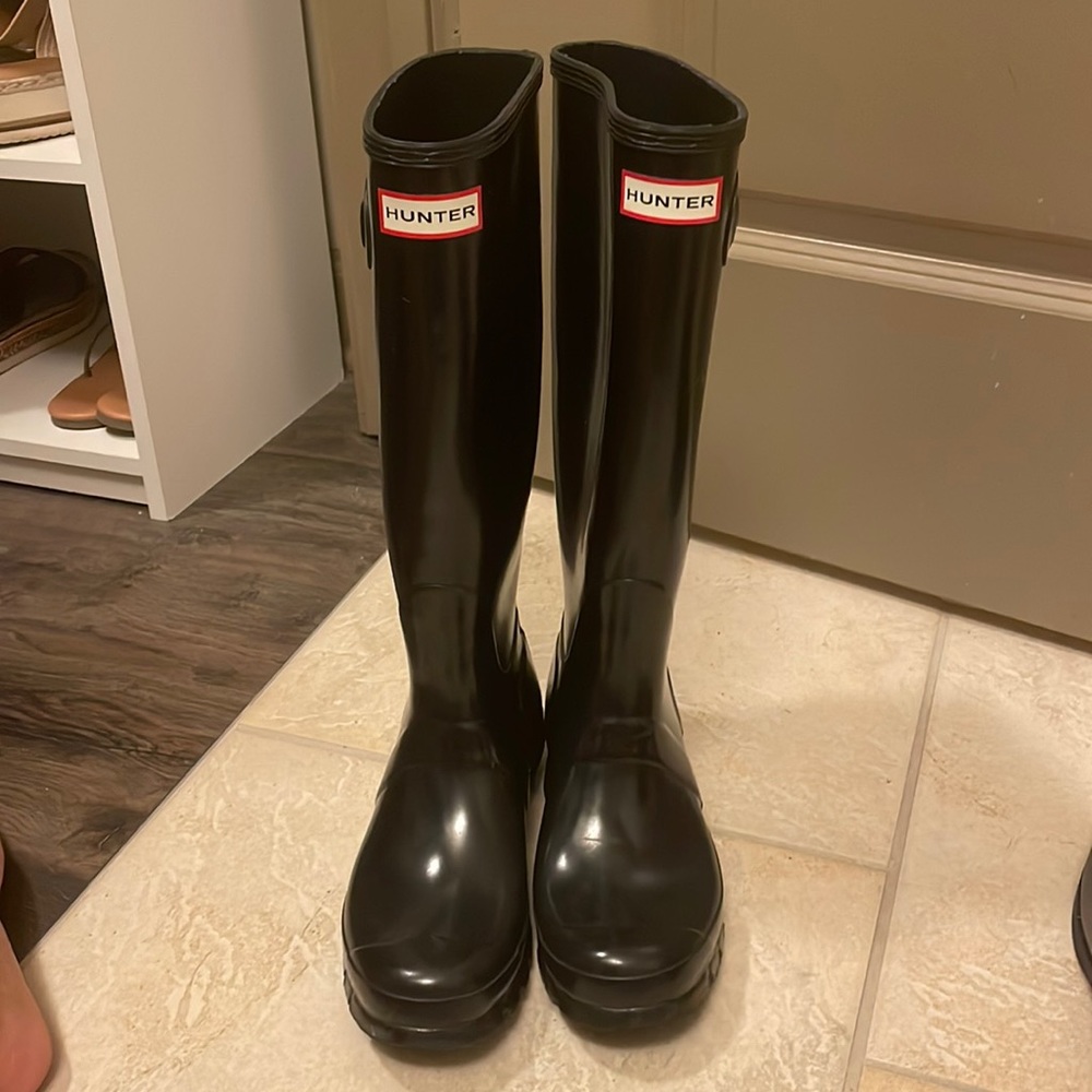 Tall shiny black Hunter boots
